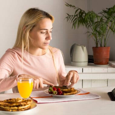 girl having waffles watching tablet Bin Recipes