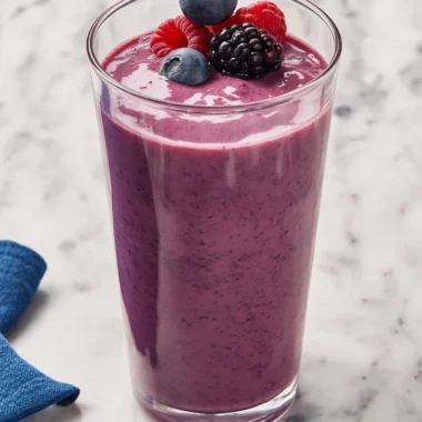 High-protein smoothie with mixed berries and spinach in a glass