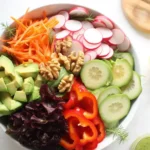 Cucumber avocado detox salad with fresh vegetables and vibrant colors.