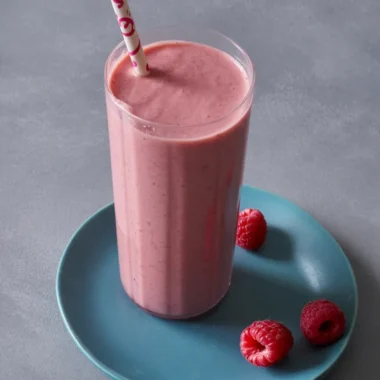 Healthy banana smoothie for weight loss with almond milk and oats in a glass.
